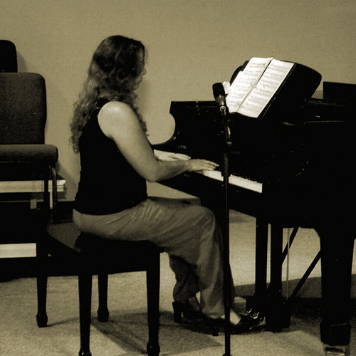 Anna Playing a Grand Piano